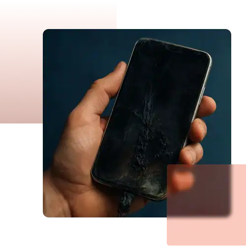 Close-up of a hand holding a burned smartphone with a damaged charging cable, symbolizing product defect and liability