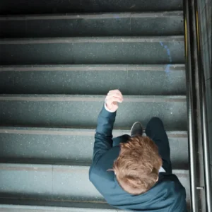 Construction accident: worker slipping and falling on a hazardous site
